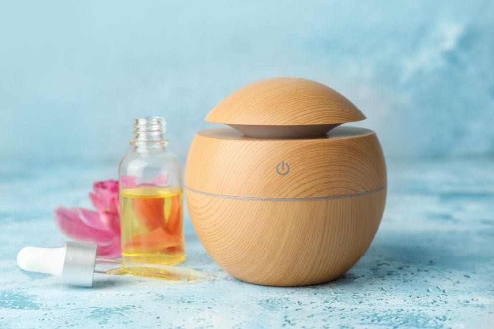an electric diffuser with an essential oil bottle