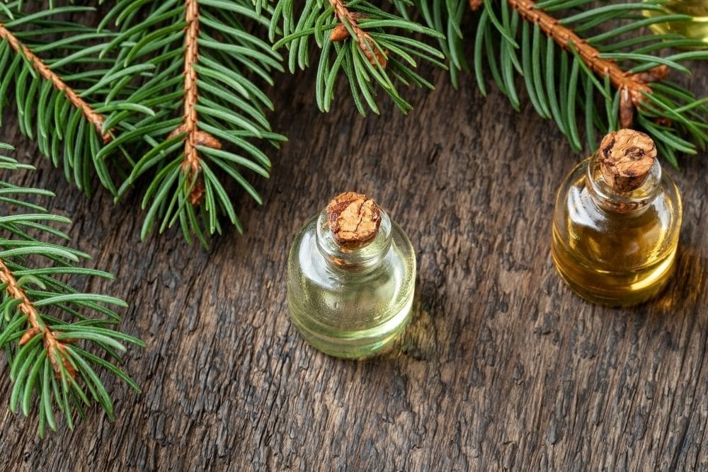 two tiny oil bottles on a table