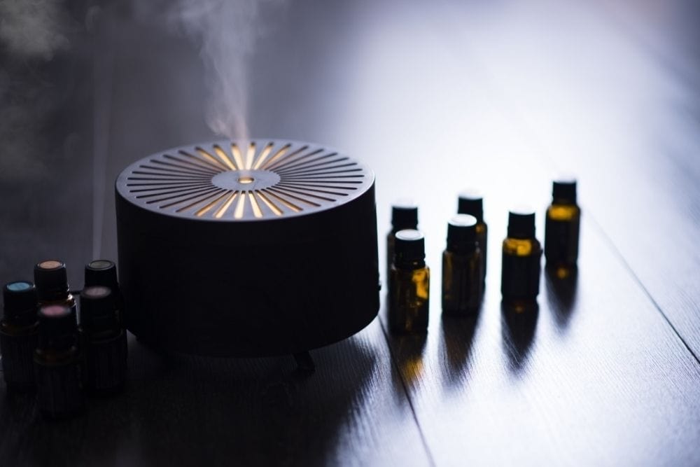 Essential oil bottles with a diffuser on a table