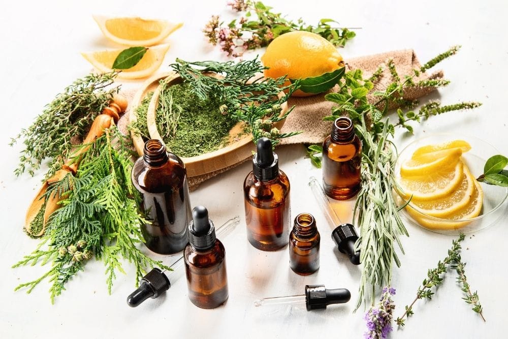 five oil bottles with oranges, leaf, lavender